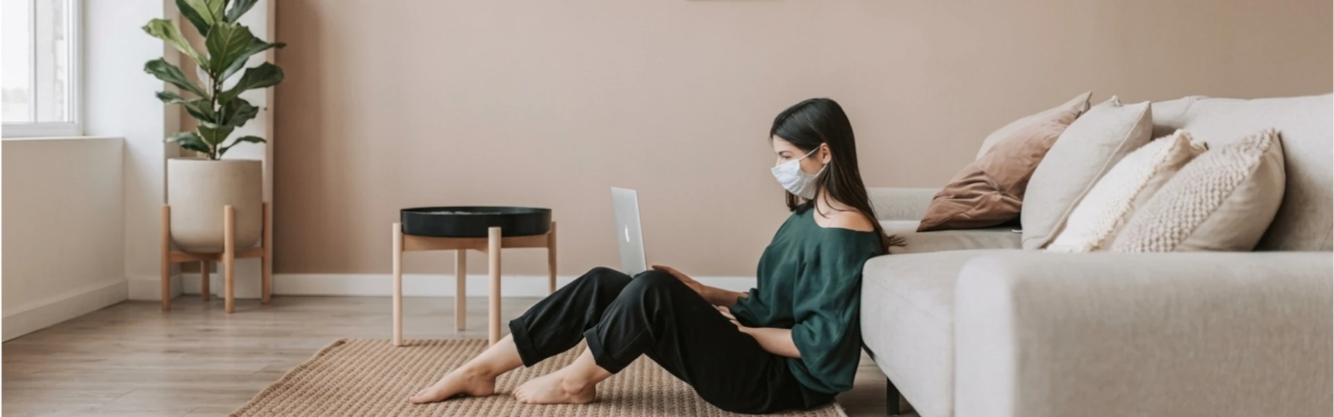 Odyssey Blog Banner showing someone working from home on their laptop.