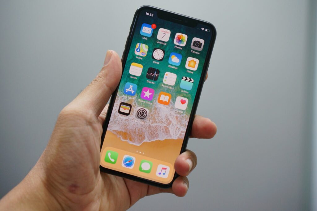 A man holding an iPhone.