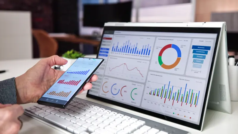 An image of analytics on a pc and phone